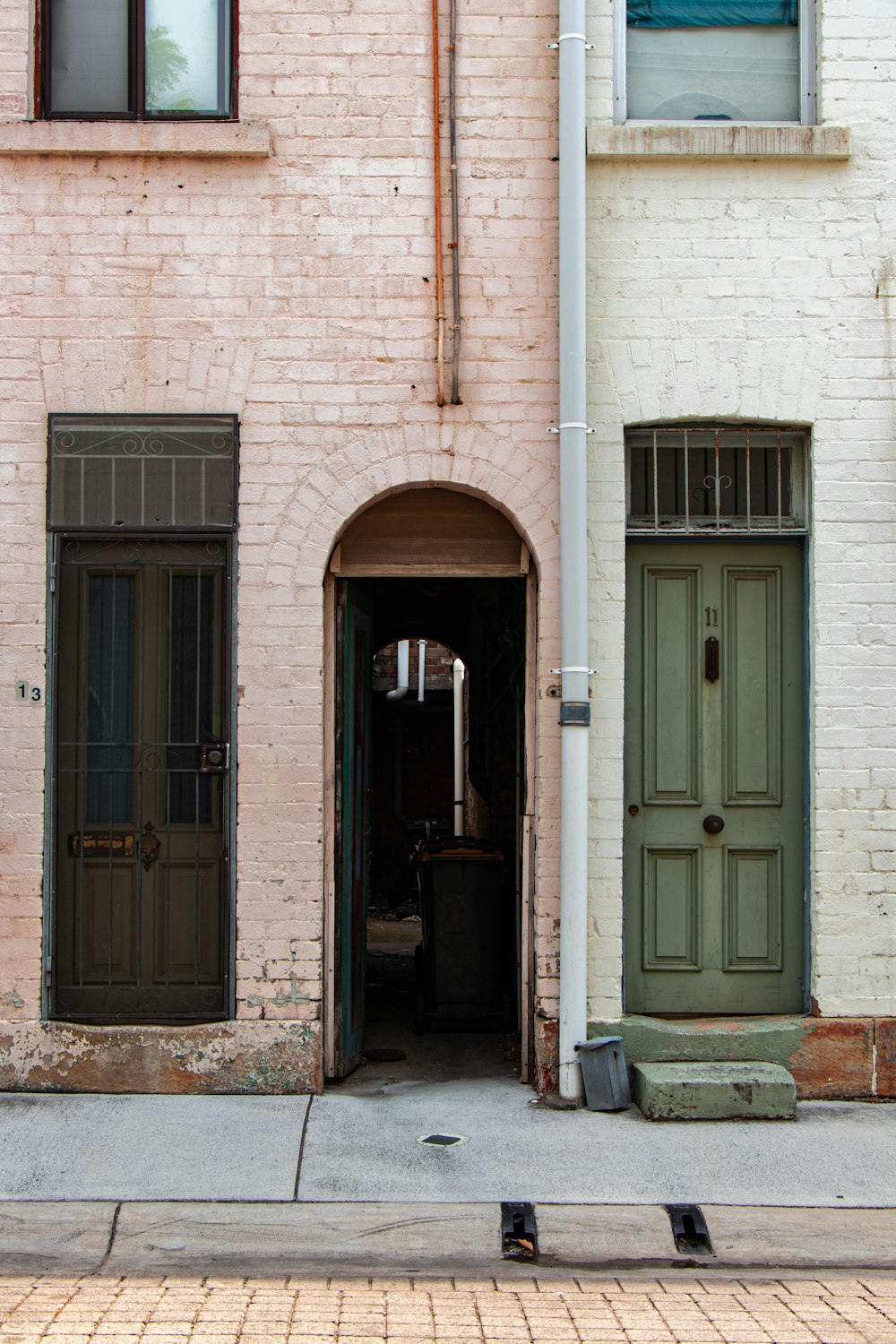 archway of a brown concrete building