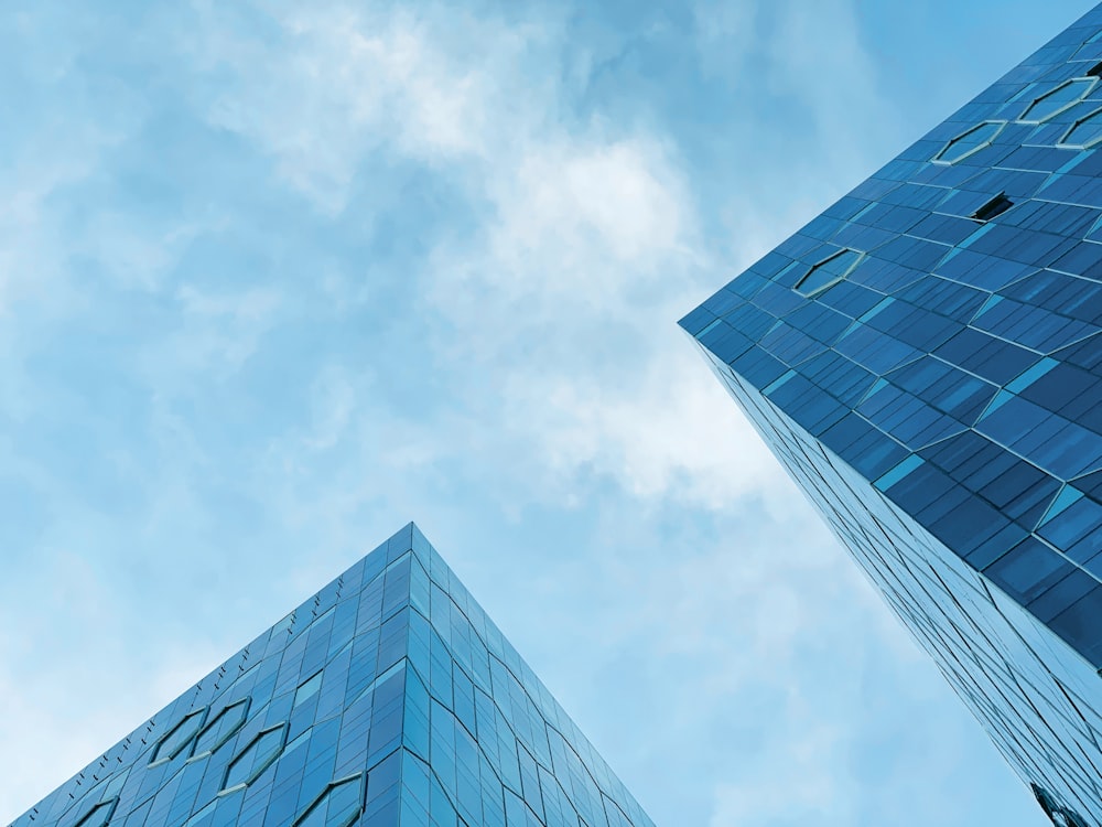 low-angle photograph of two buildings