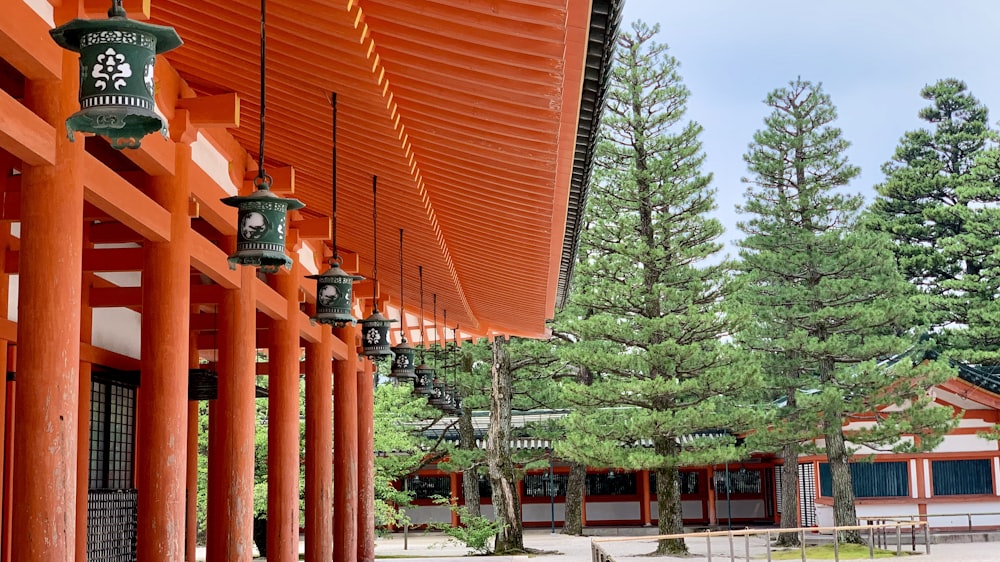 brown and red structures near trees