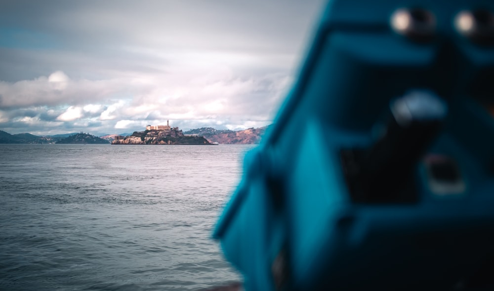 a view of a castle in the middle of the ocean