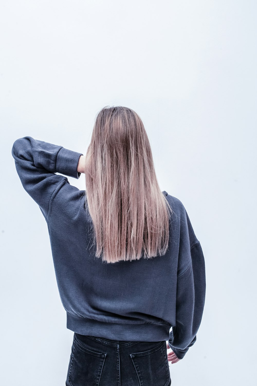 woman touching her hair