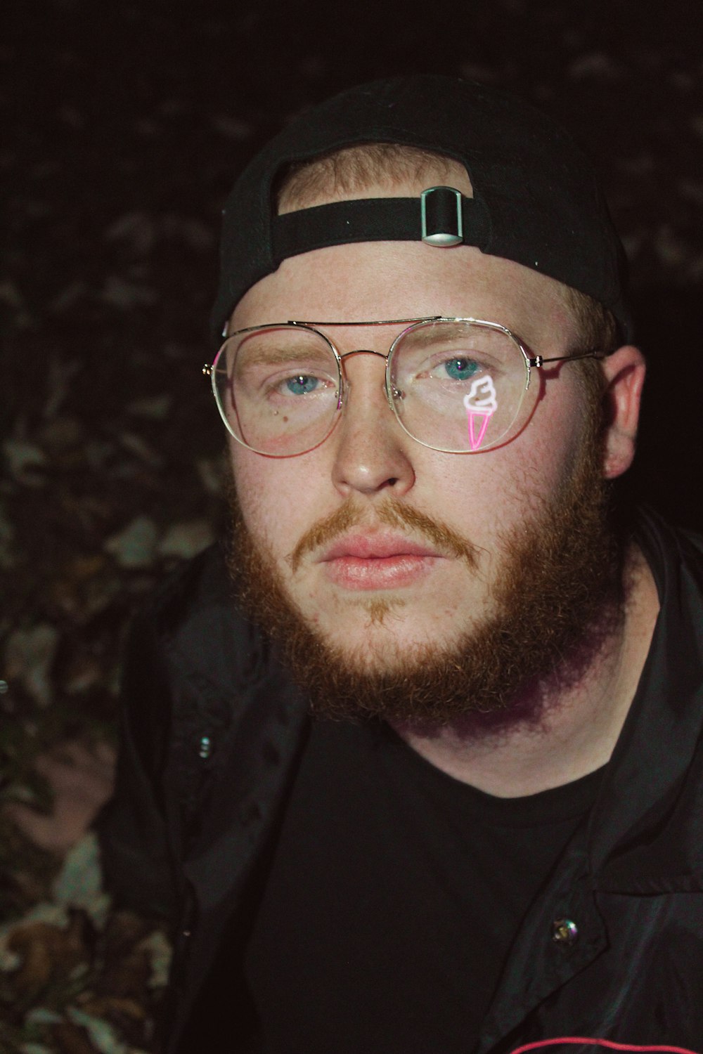 man wearing eyeglasses and cap