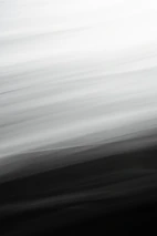 Abstract glowing gradient lines flowing smoothly over a pitch-black background.