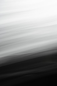 Abstract black and white parallax background with smooth animated layers creating depth.