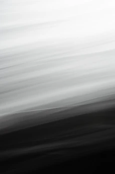 Abstract glowing gradient lines flowing smoothly over a pitch-black background.
