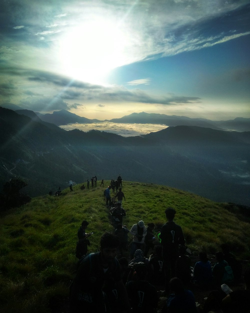 people walking on hill