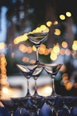 Artistic shot of tiramisu glasses stacked in a shimmering champagne tower at a celebration