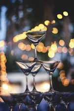 Elegant tiramisu champagne glass pyramid glowing softly in warm wedding lighting