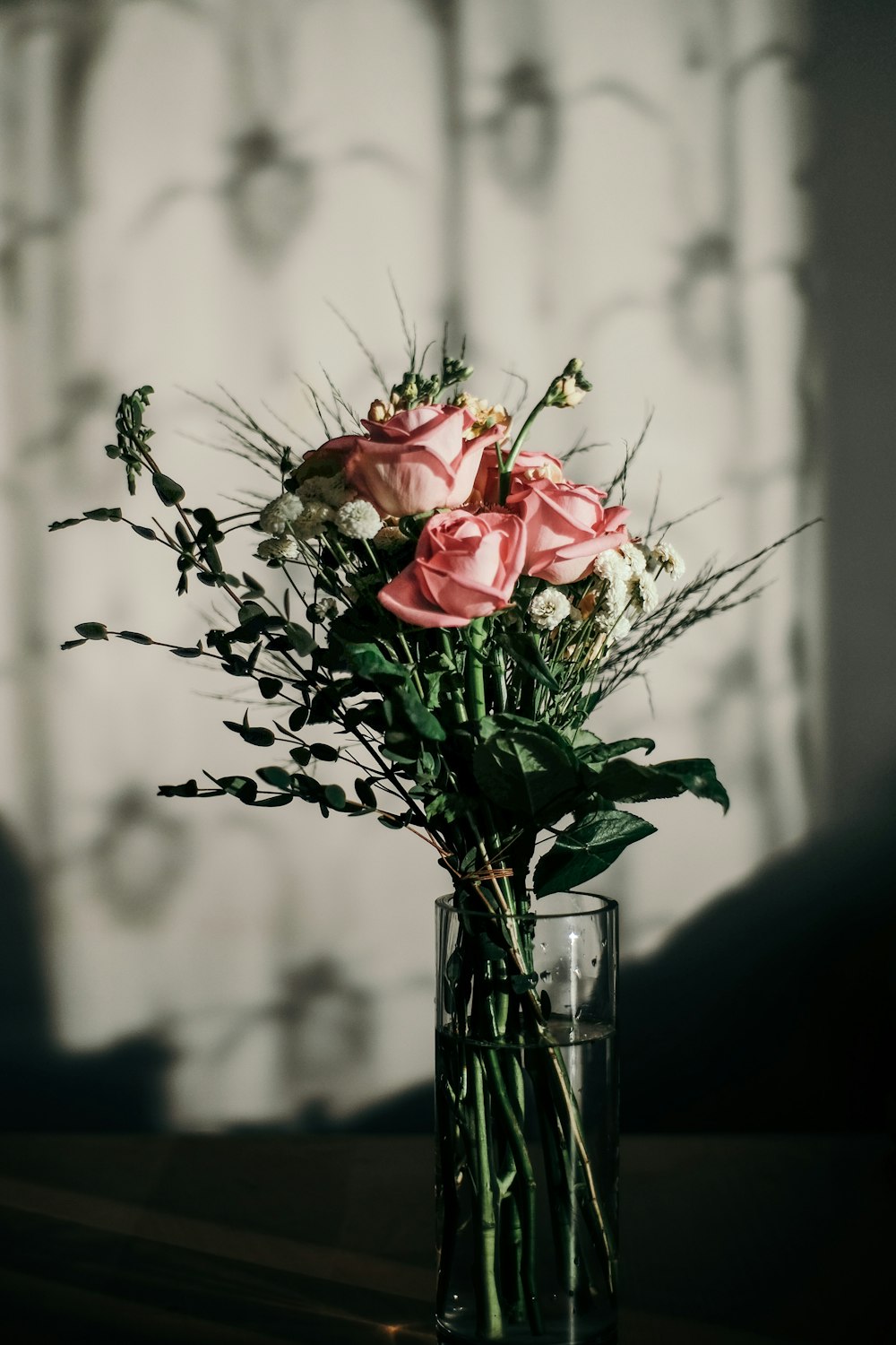 pink rose in glass vase