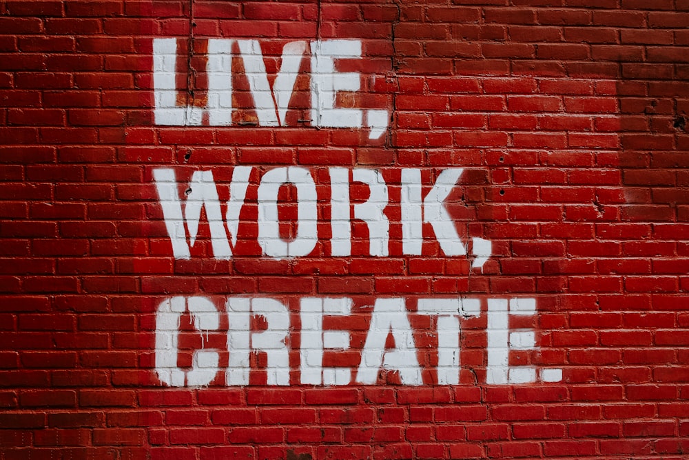 Live, Work, Create. graffiti on brick wall