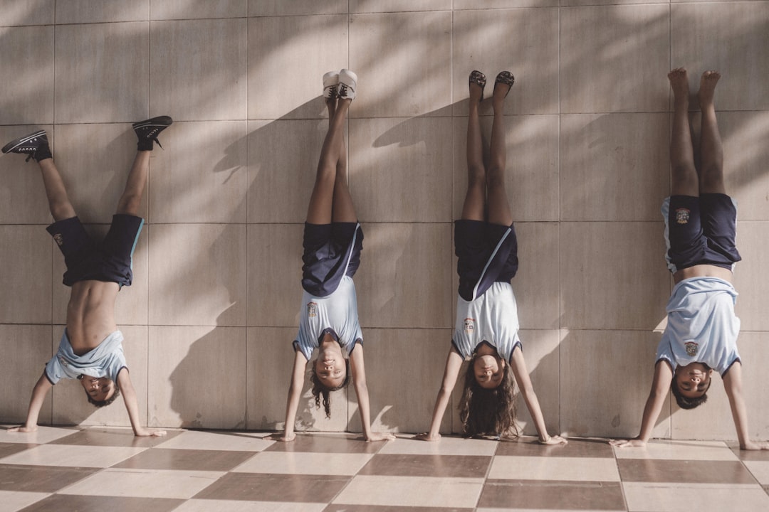 four person near the wall,