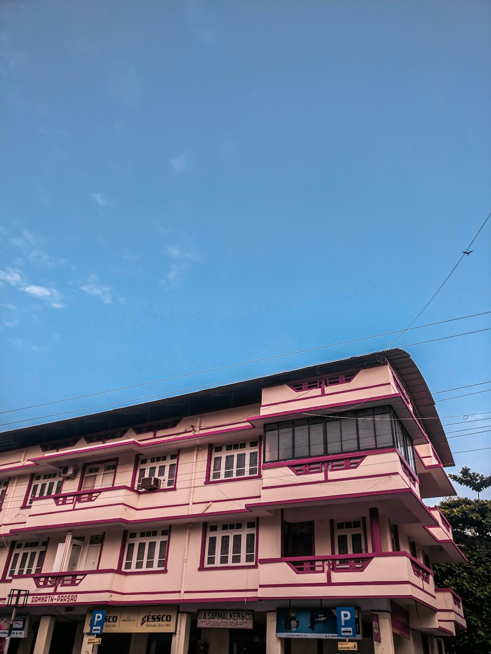 pink building under blue and white sky