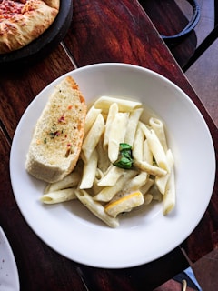 cooked pasta and baked bread