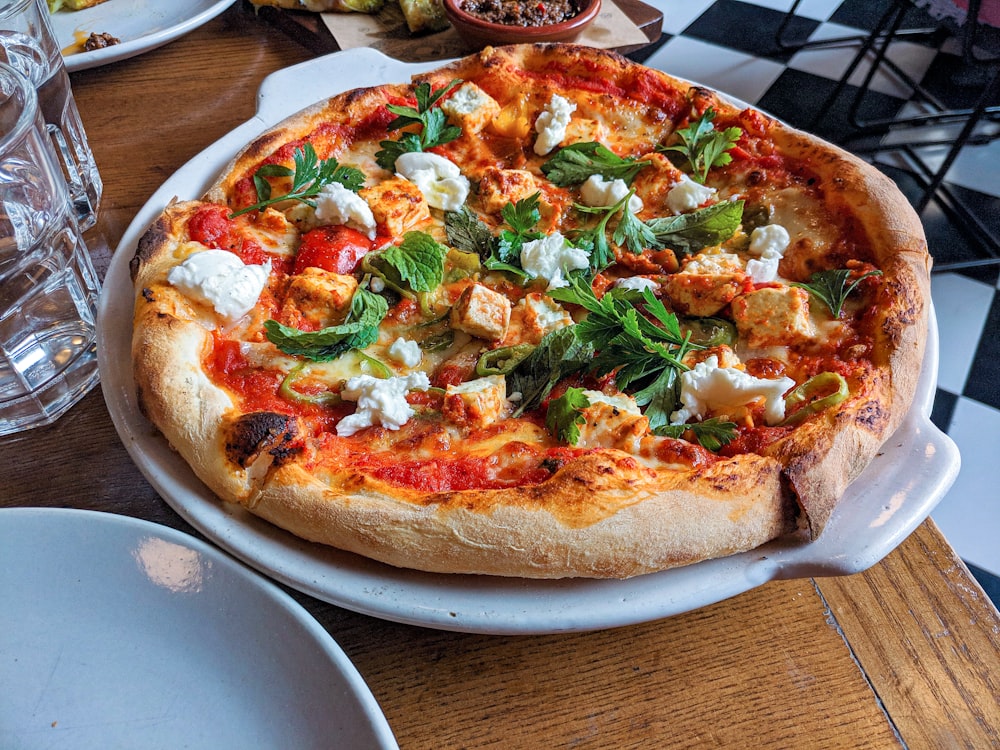 pizza with basil leaves