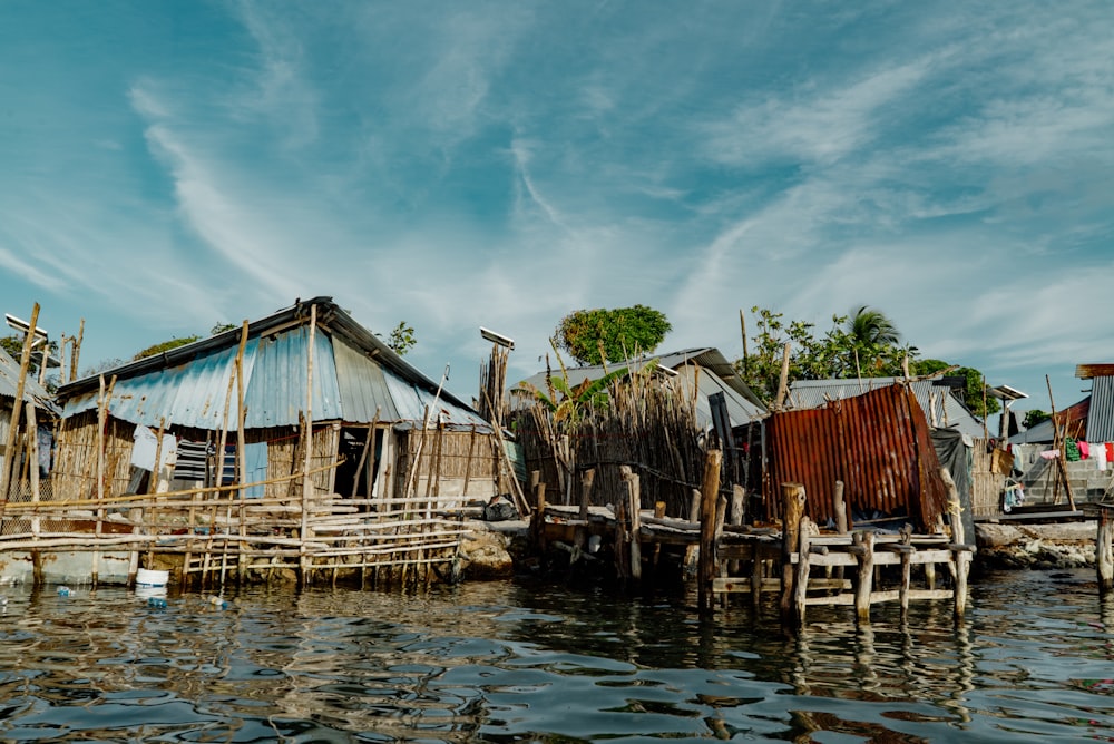 brown wooden floating cottage during daytiem