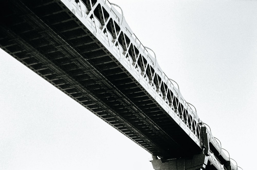 a black and white photo of a bridge