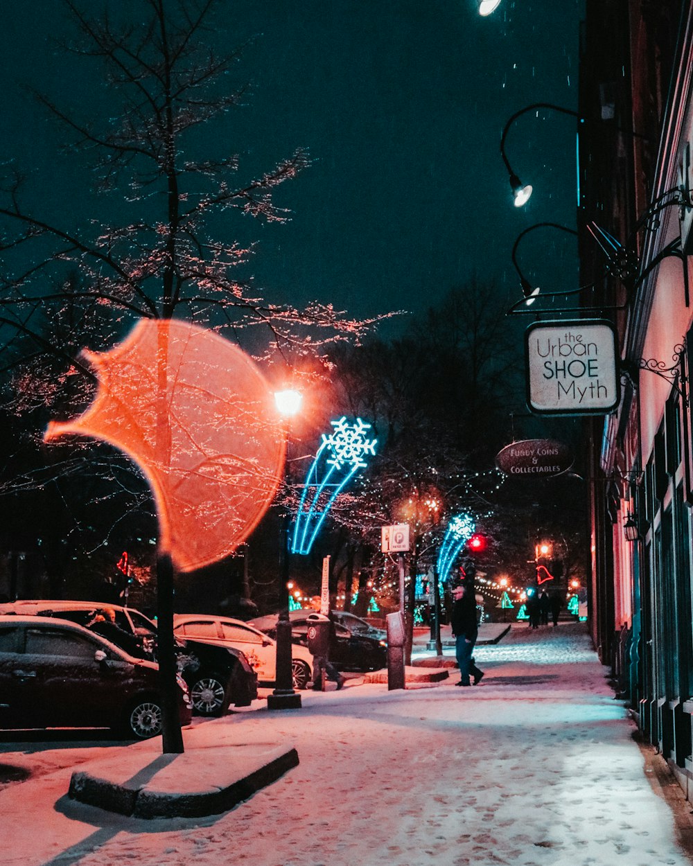 view photography of cars parked near building and trees