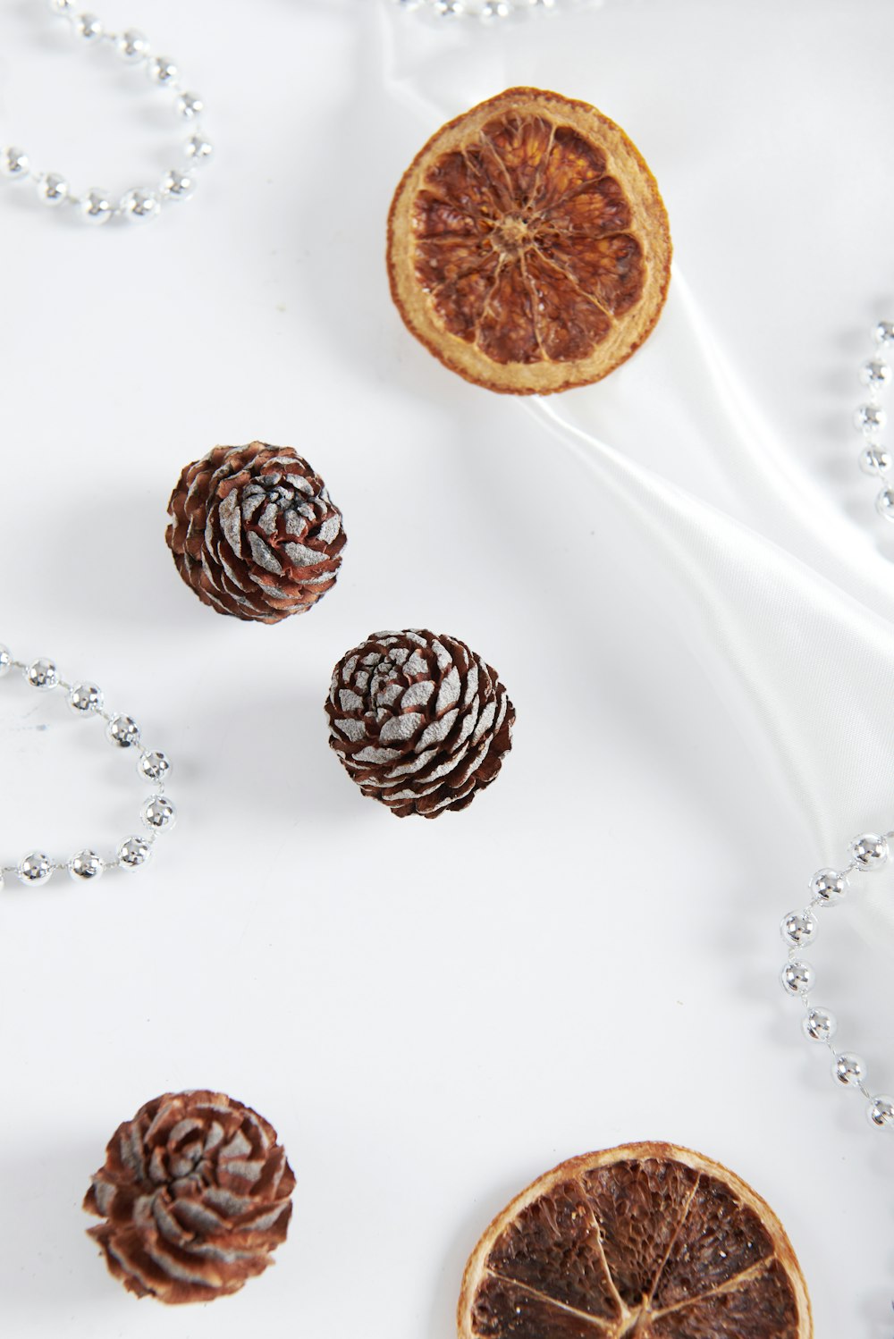 a group of pine cones sitting on top of a white table