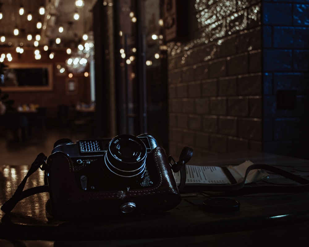 shallow focus photo of black SLR camera