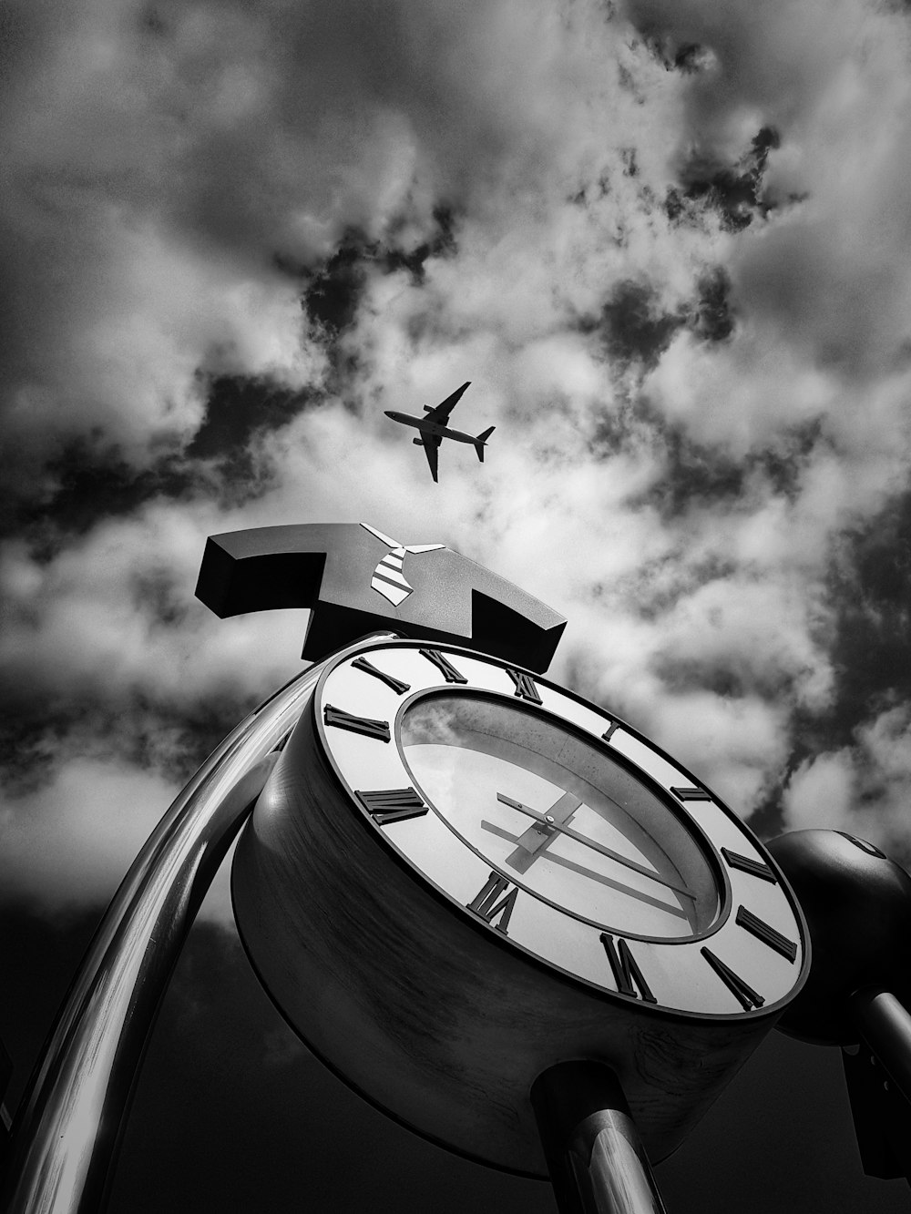 grayscale photo of flying airplane