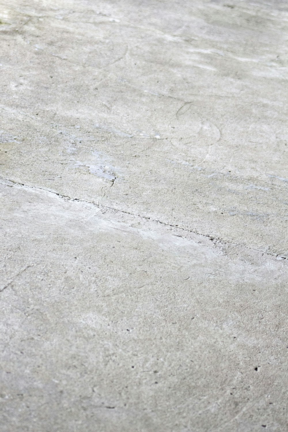 a person riding a skateboard on a concrete surface