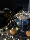person pouring wine on glass