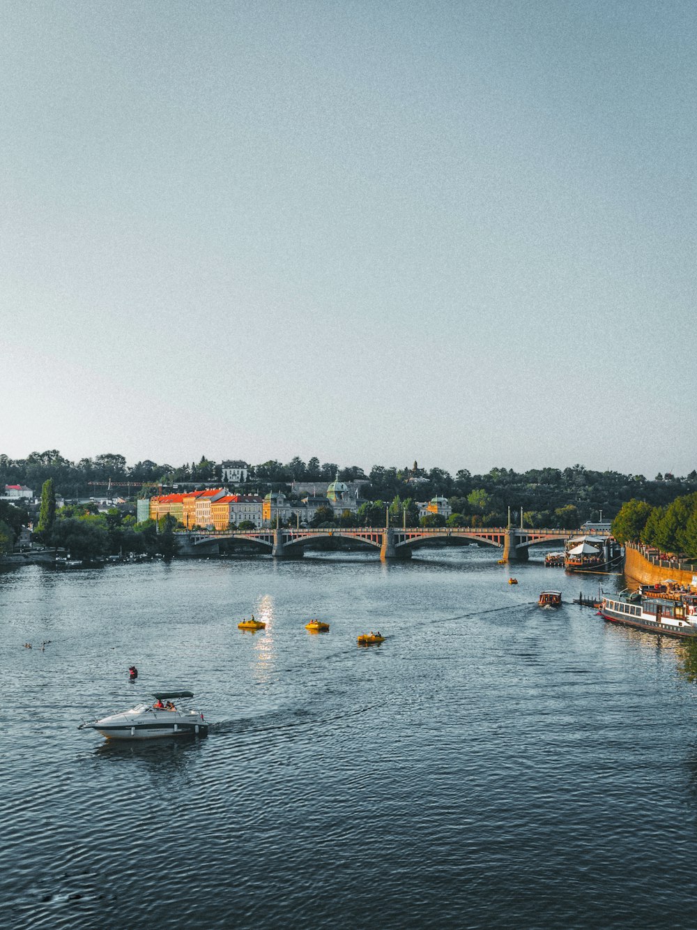 people riding on boat on river during daytime