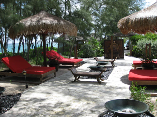 A peaceful outdoor area in Calangute with comfortable lounge chairs for post-massage relaxation.