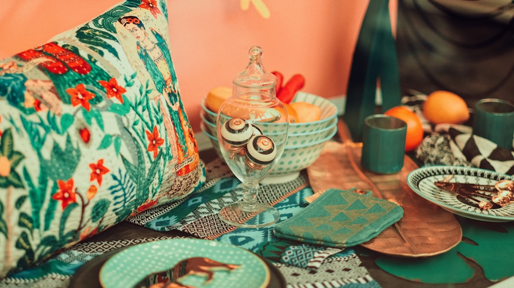 a table topped with plates and bowls of food