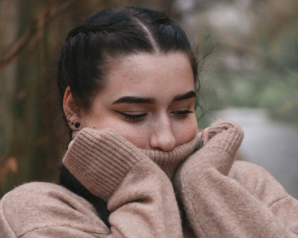 woman in brown turtleneck sweater