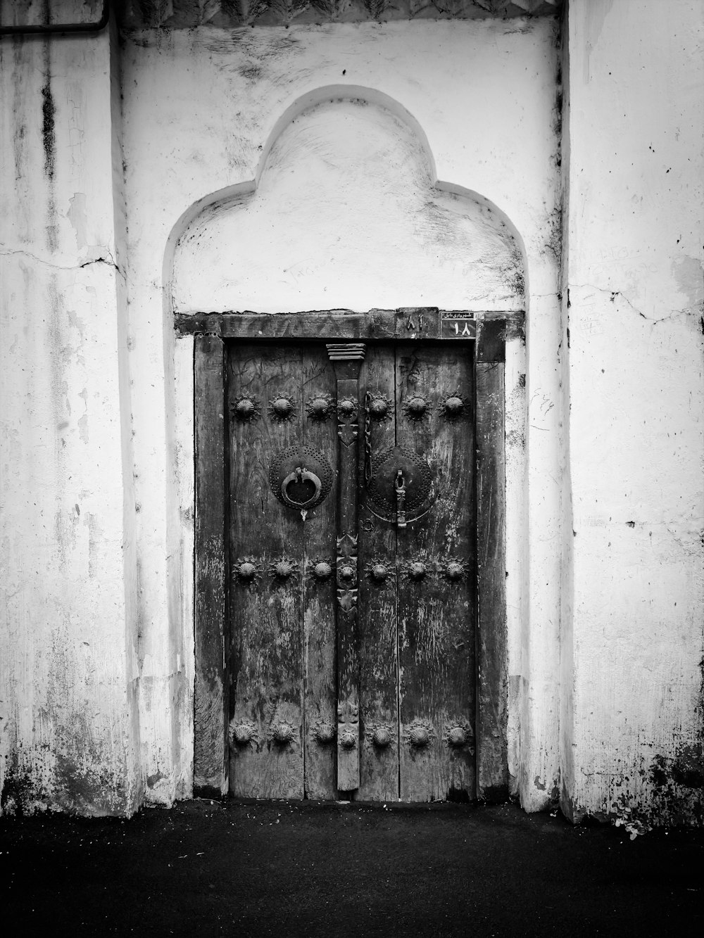 closed barn door in monochrome photo