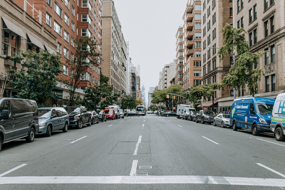 view photography of cars parked near buildings during daytime