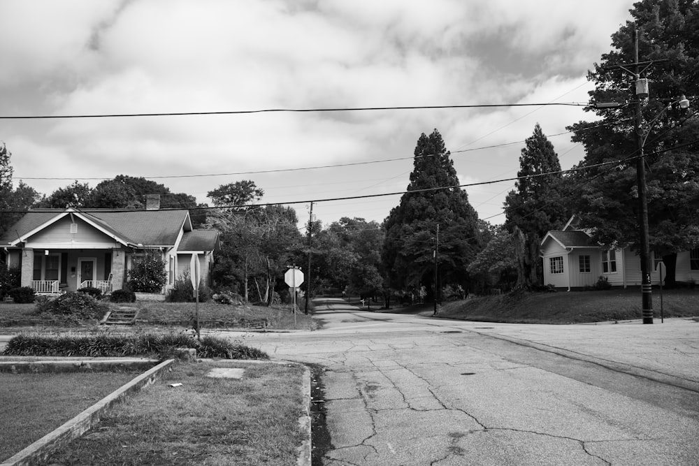 grayscale photography of house and road