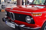 red BMW New Class vehicle