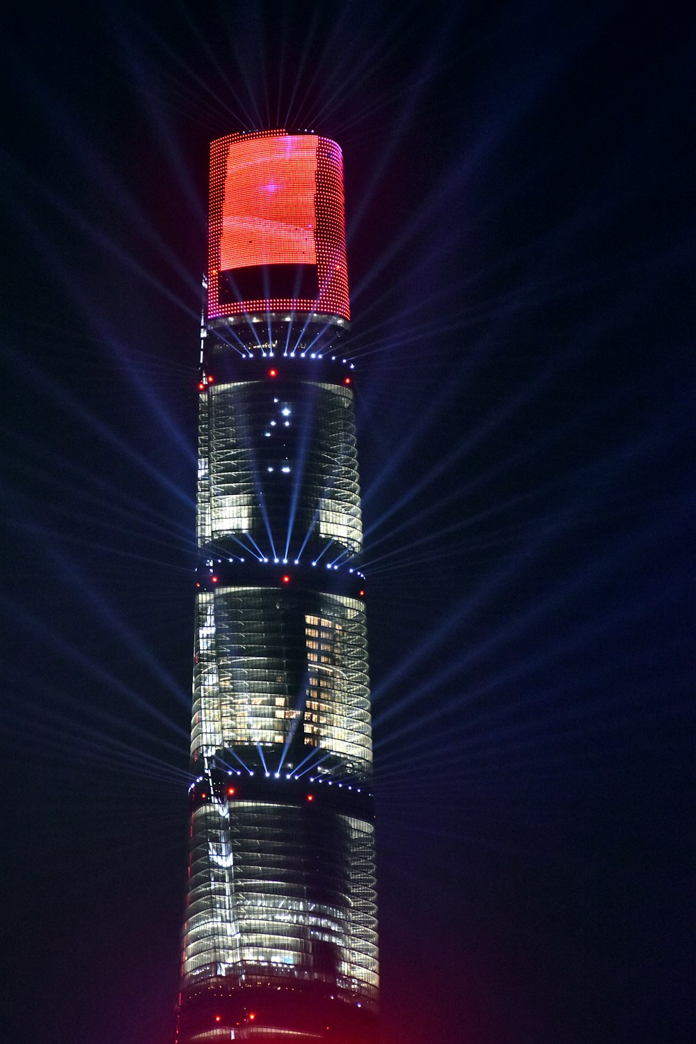 clear glass walled high-rise building during night time