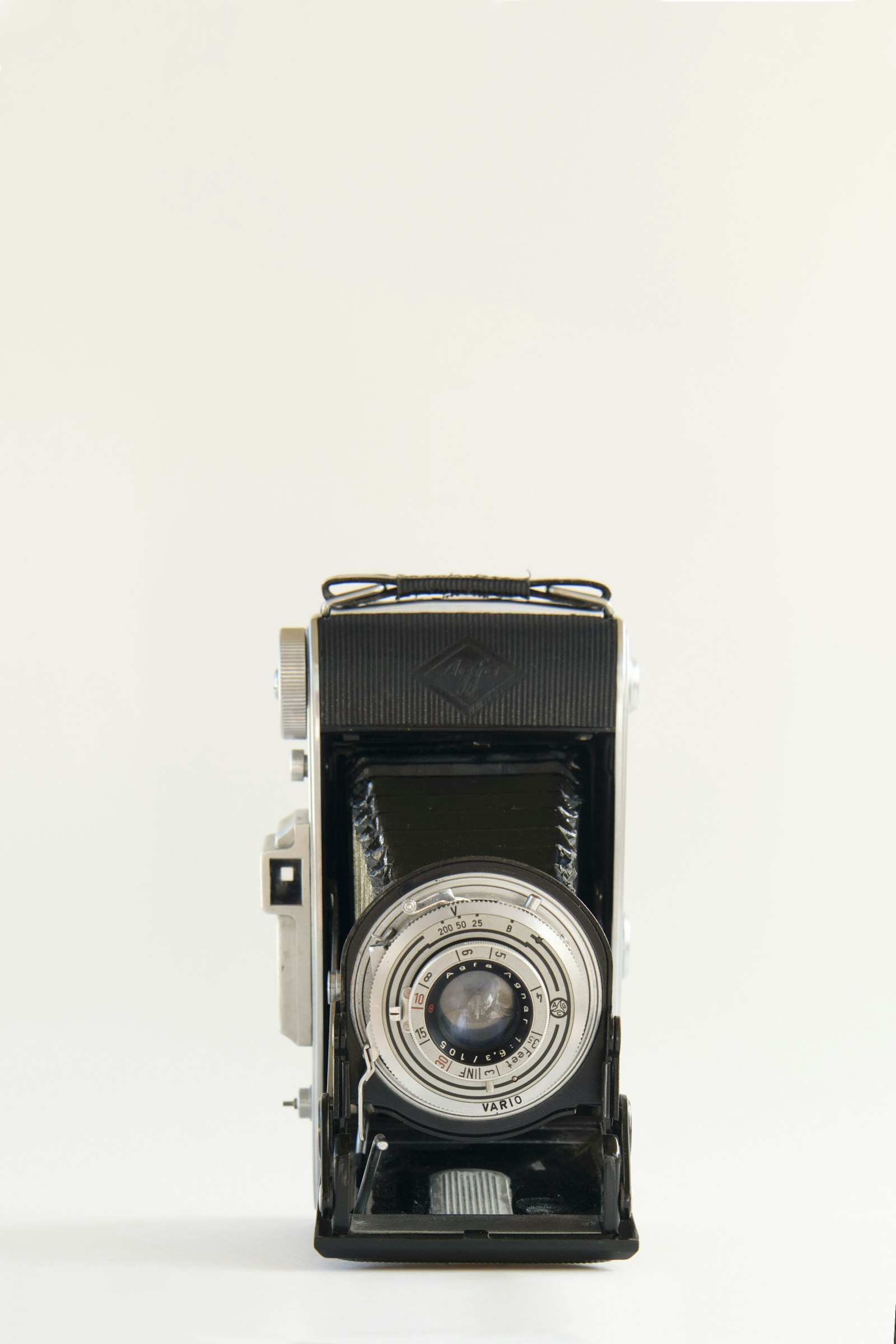 Nikon AF-S Nikkor 24-70mm F2.8E ED VR sample photo. Vintage black folding camera photography