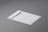 A white envelope with a minimalistic design lies on a smooth gray surface. The envelope features a simple logo or emblem in the top corner.
