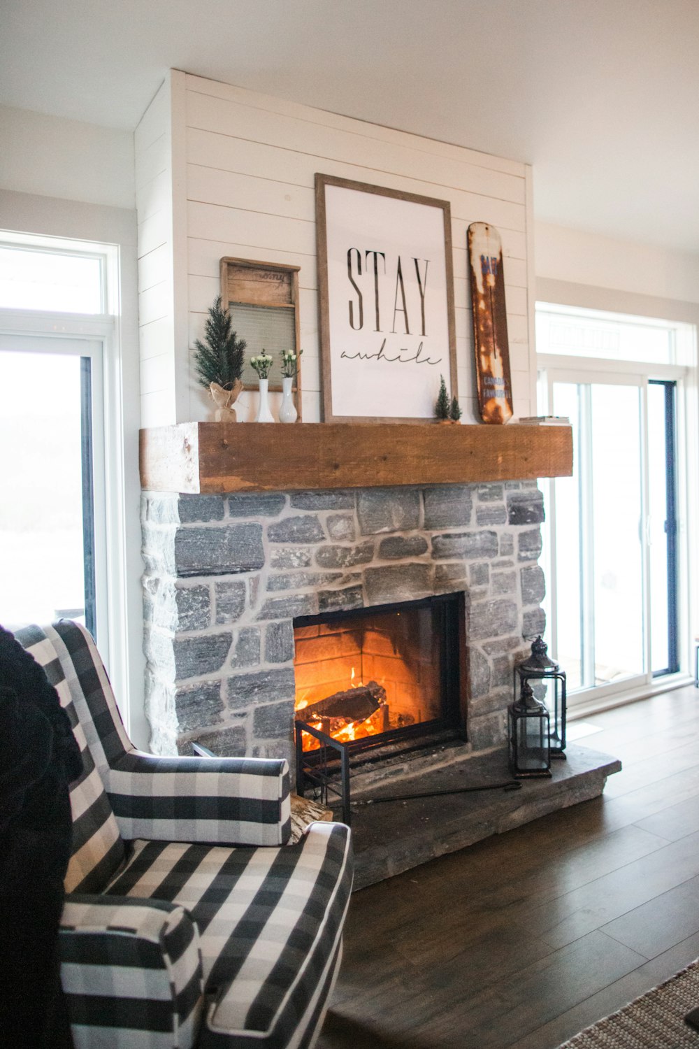 two black sconce lamps near fireplace