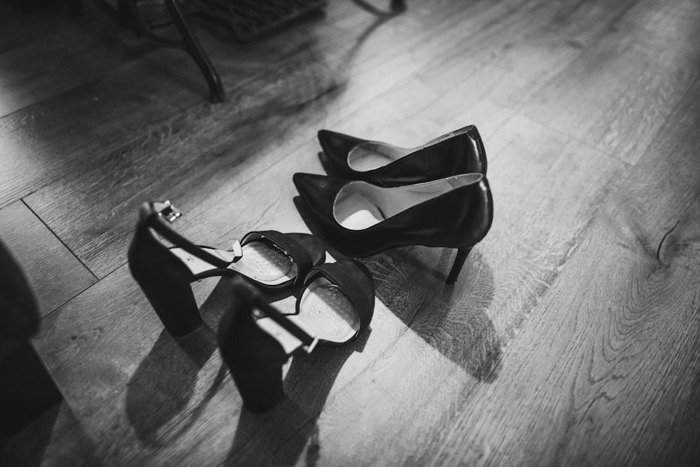 grayscale photography of pumps and stiletto sandals