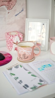 pink and white Hello ceramic mug