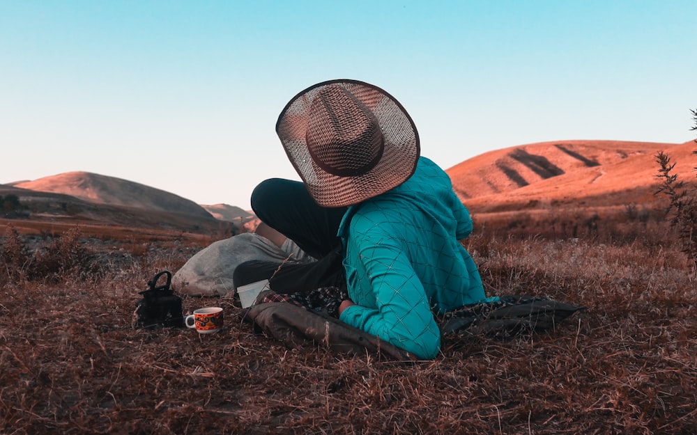 unknown person lying on grass