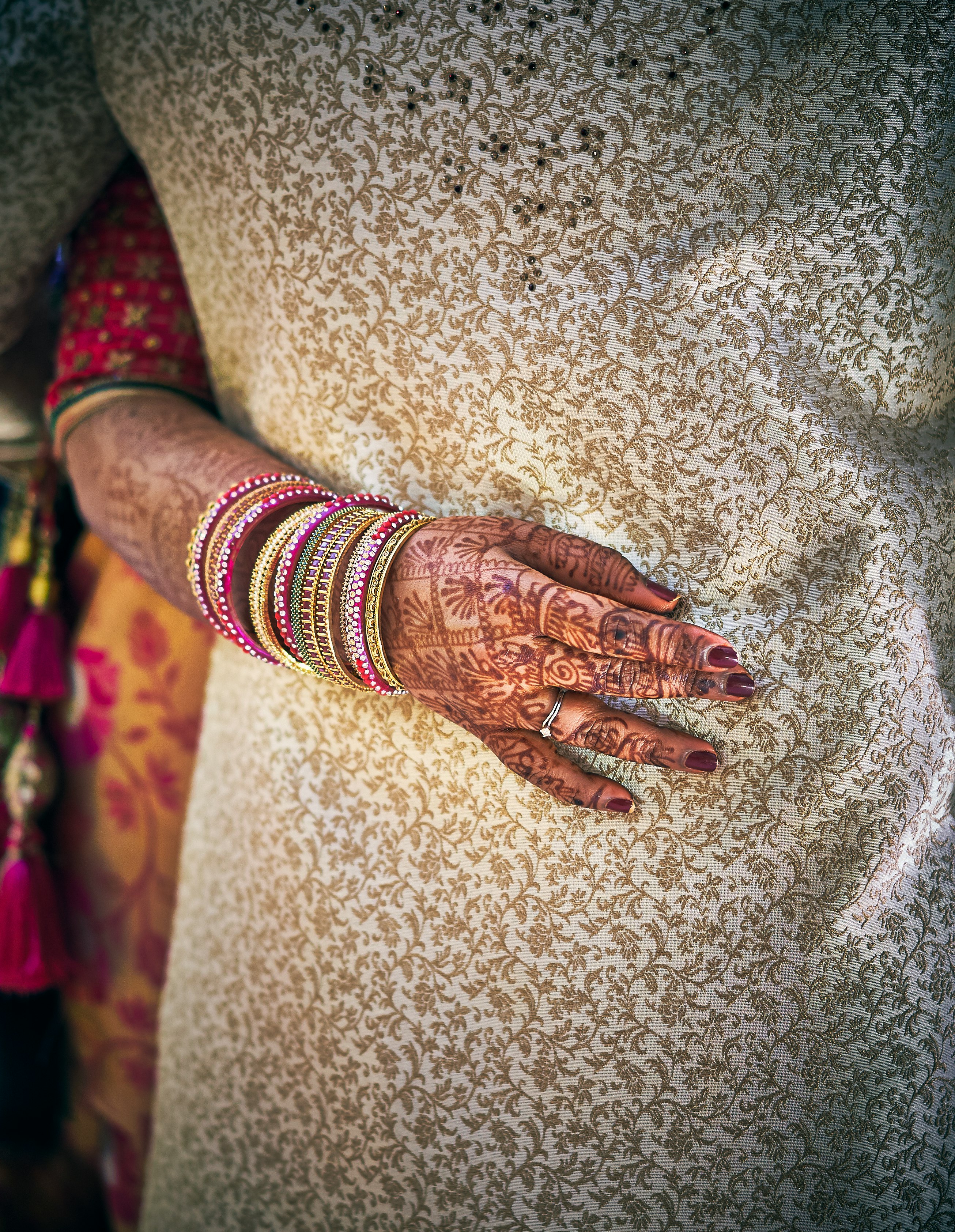 woman with mehndi tattoos and jewelries