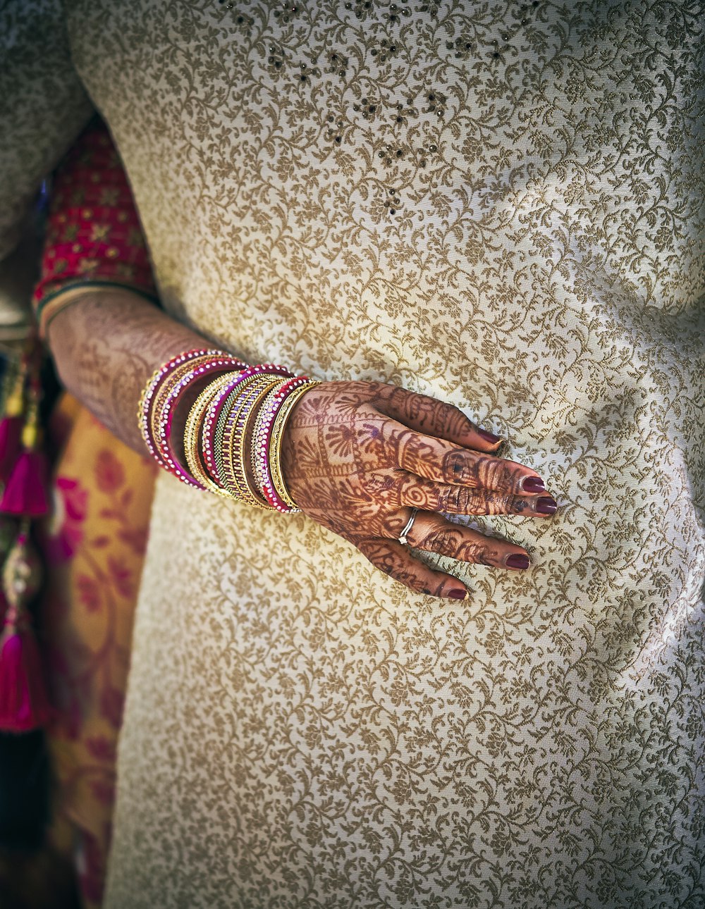 woman with mehndi tattoos and jewelries