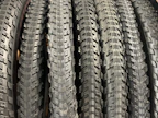Various tire accessories neatly arranged on a wooden surface