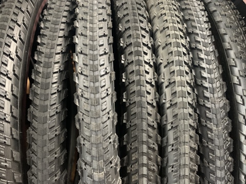 Close-up of durable bike tires stacked in a shop.