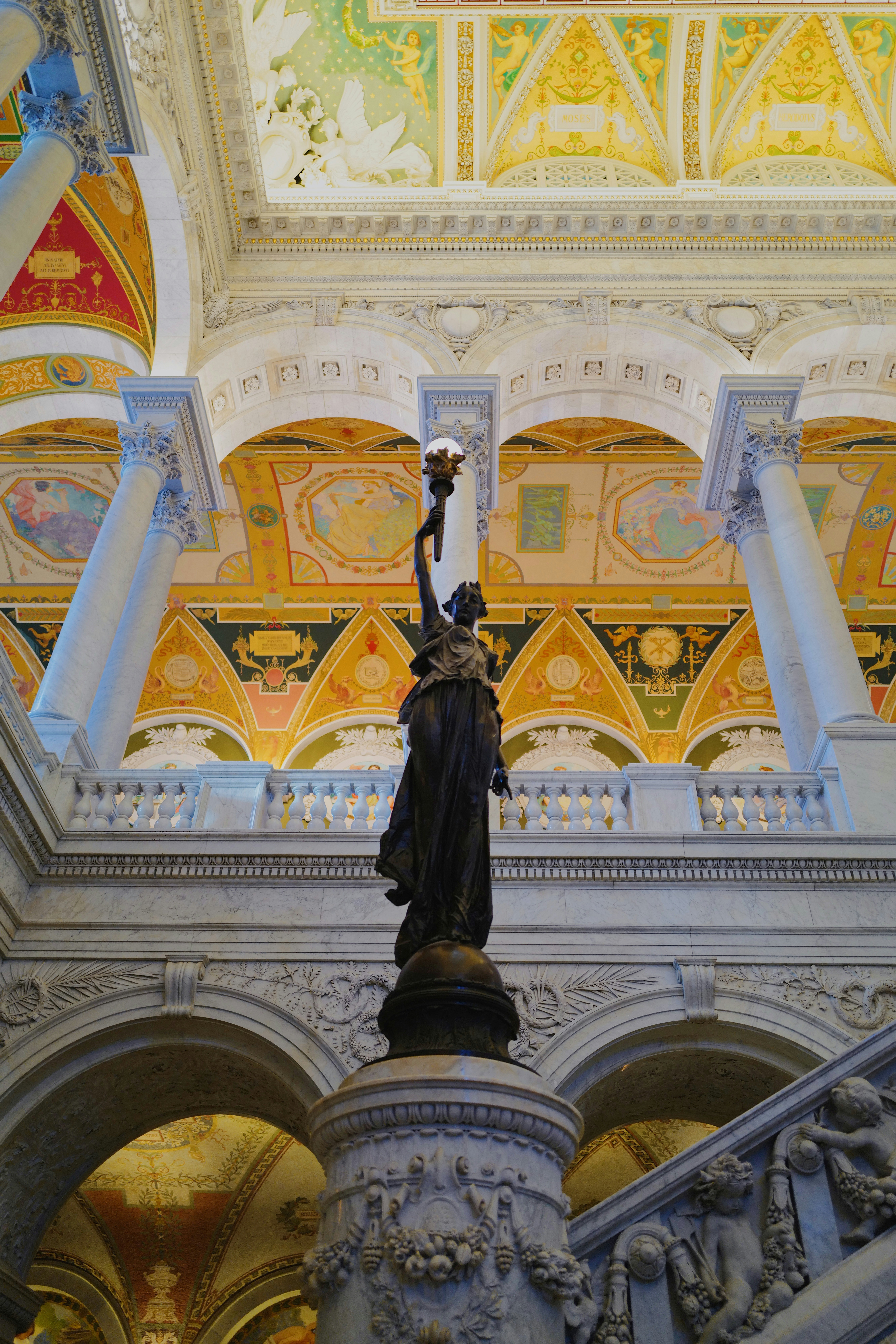 woman holding torch statue