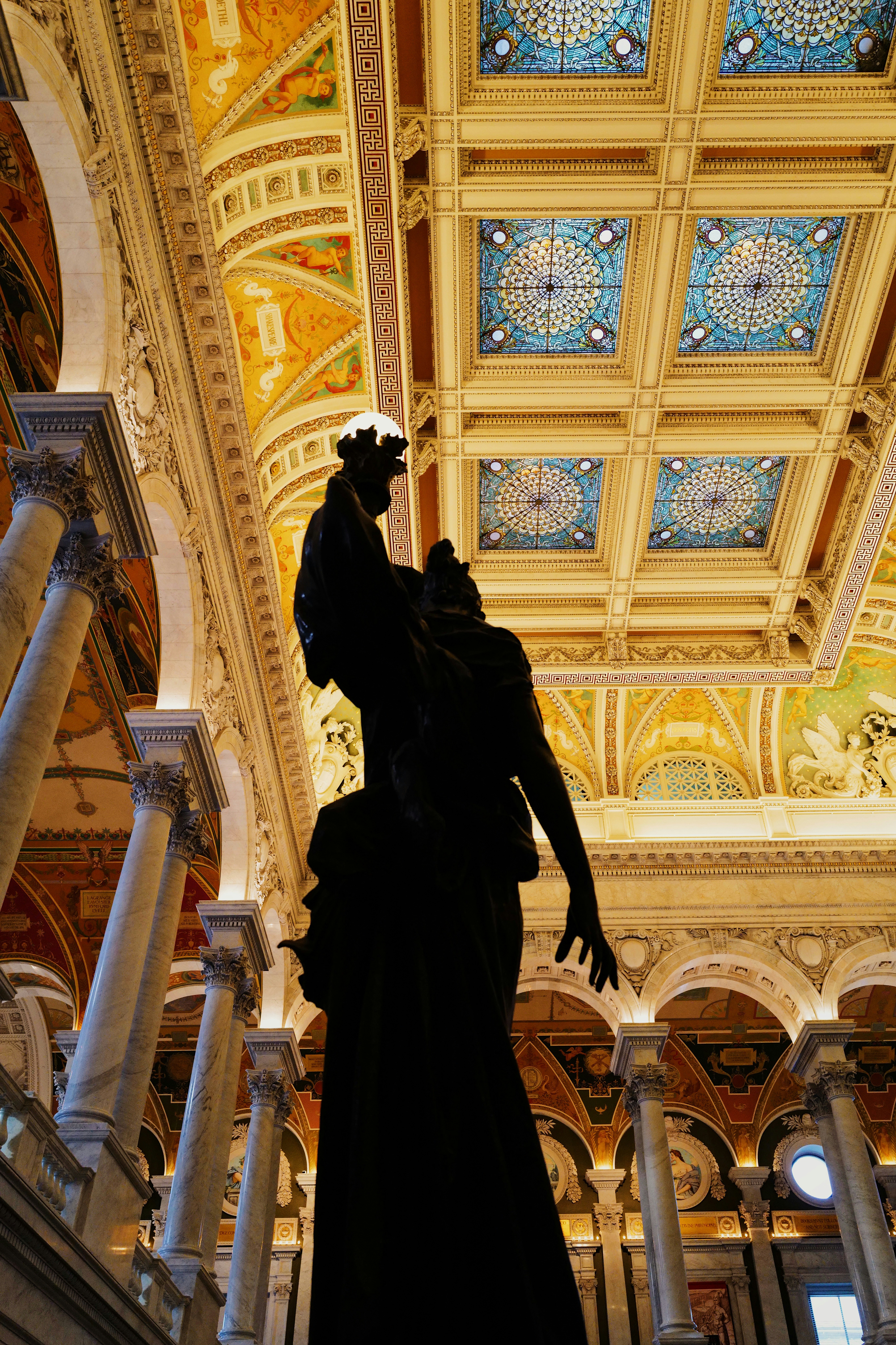 a statue of a man in a large building