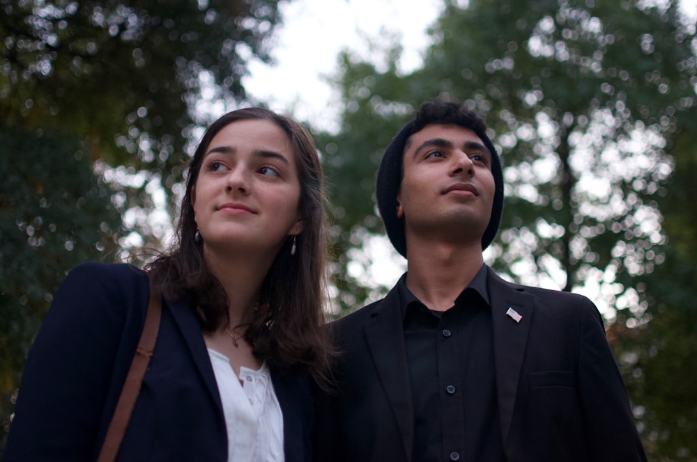 man and woman standing outdoors