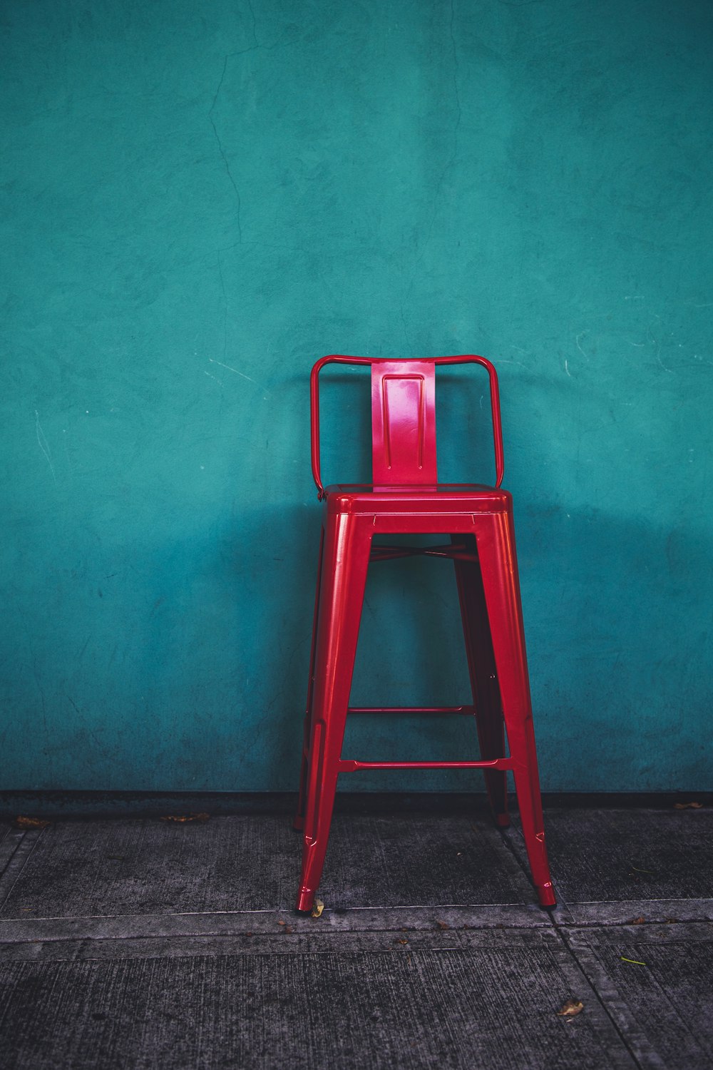red metal bar chair ]