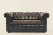 brown leather Chesterfield sofa